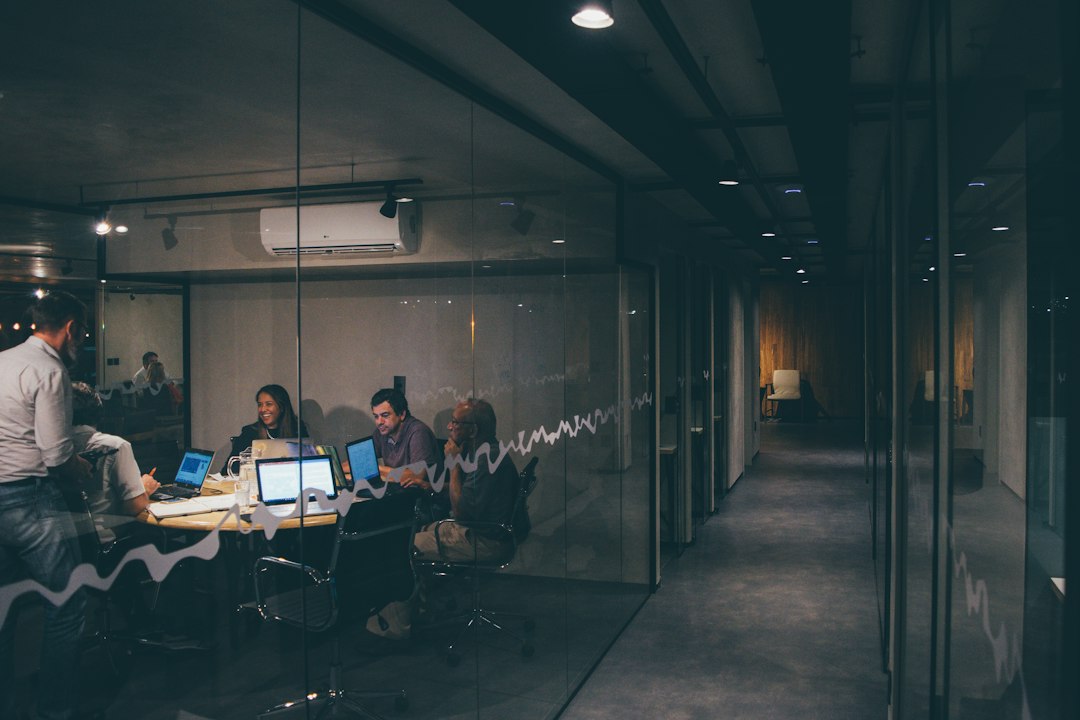 A startup team gathered around a table in a working meeting