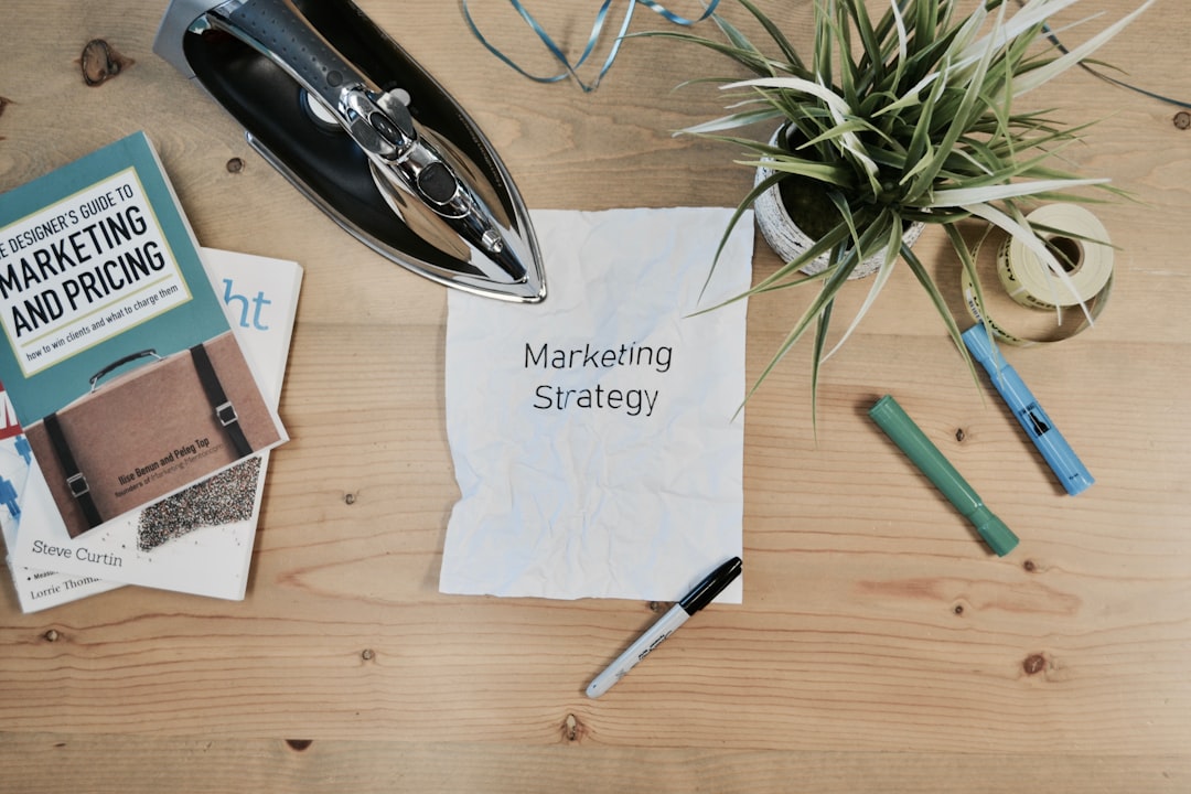A printed marketing strategy document on a desk beside budget notes