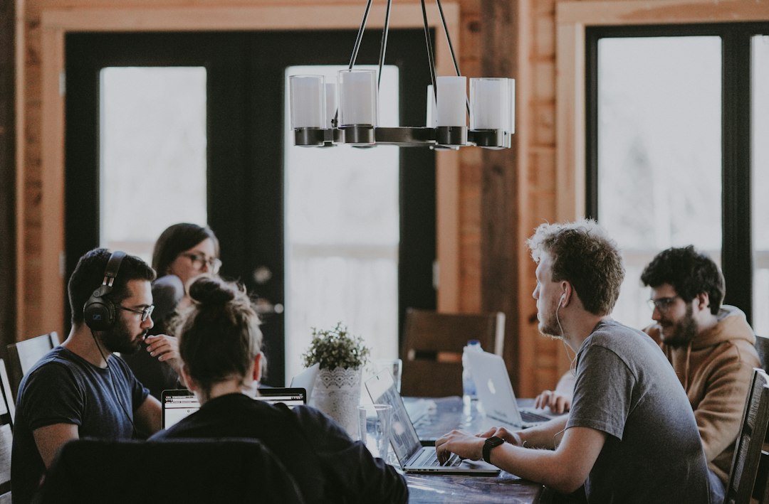 A team seated around a table reviewing marketing performance results together