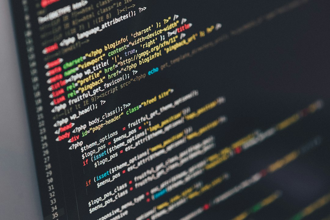 A computer monitor displaying lines of source code in a text editor