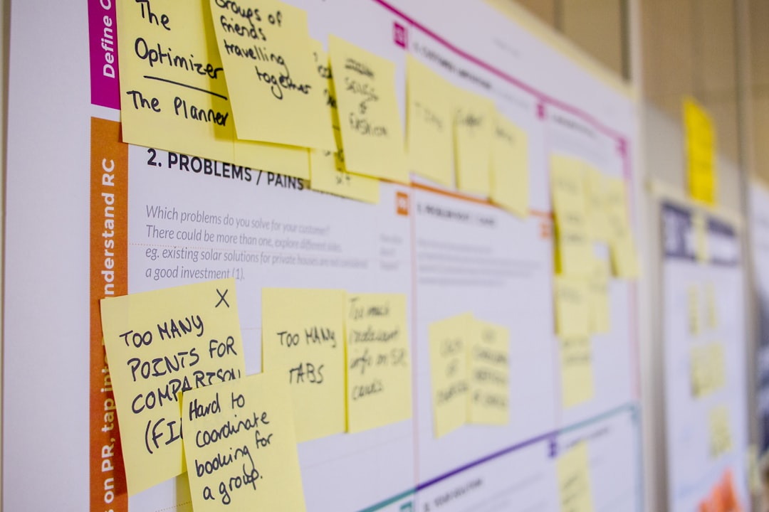Printed sticky notes arranged in columns on a planning board, mapping a quarterly marketing plan